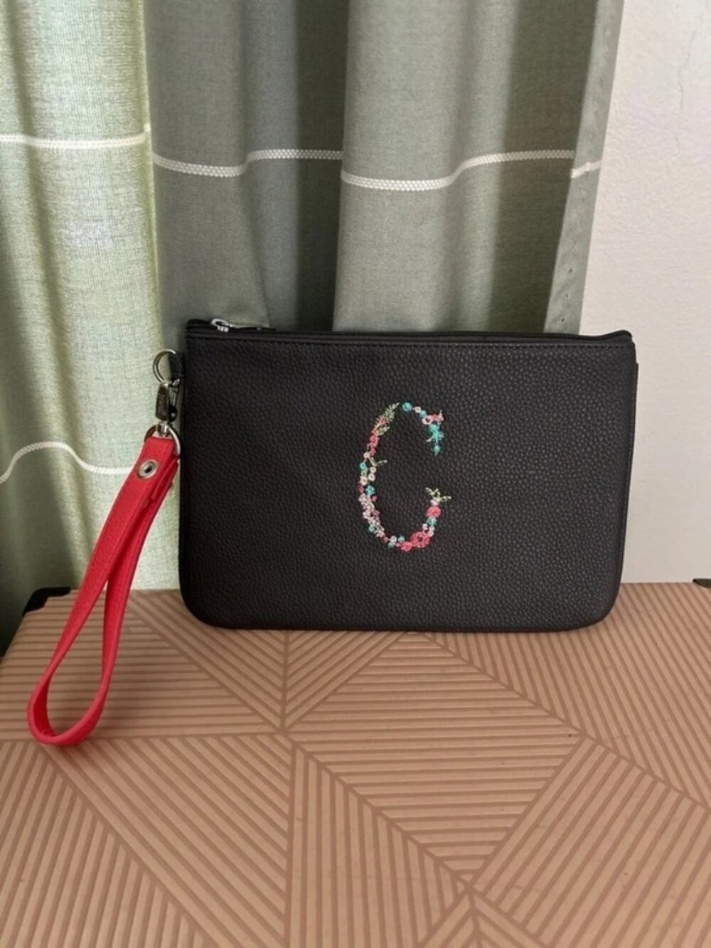 Thirty-one Wristlet bag embroidered with a floral “C”